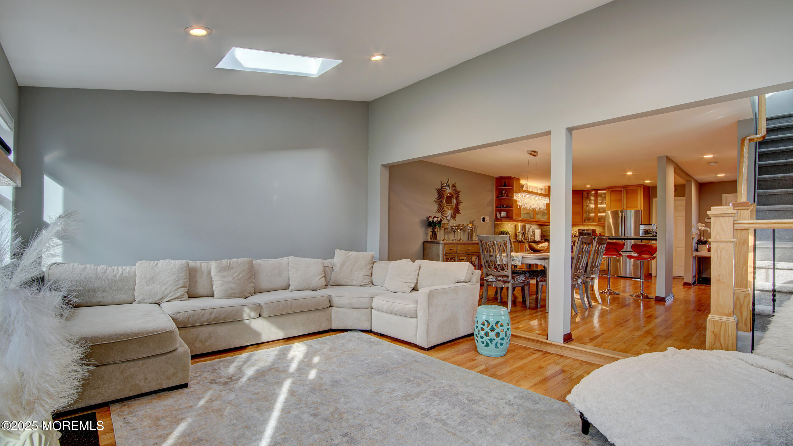 141 Chestnut Way, Unit 141 Manalapan, NJ 07726 - Photo 19 of 46 a living room with furniture and wooden floor