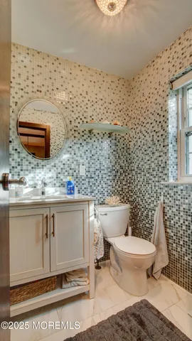 a bathroom with a toilet and a sink