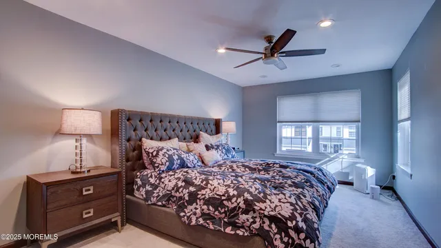 a bedroom with a large bed and a window