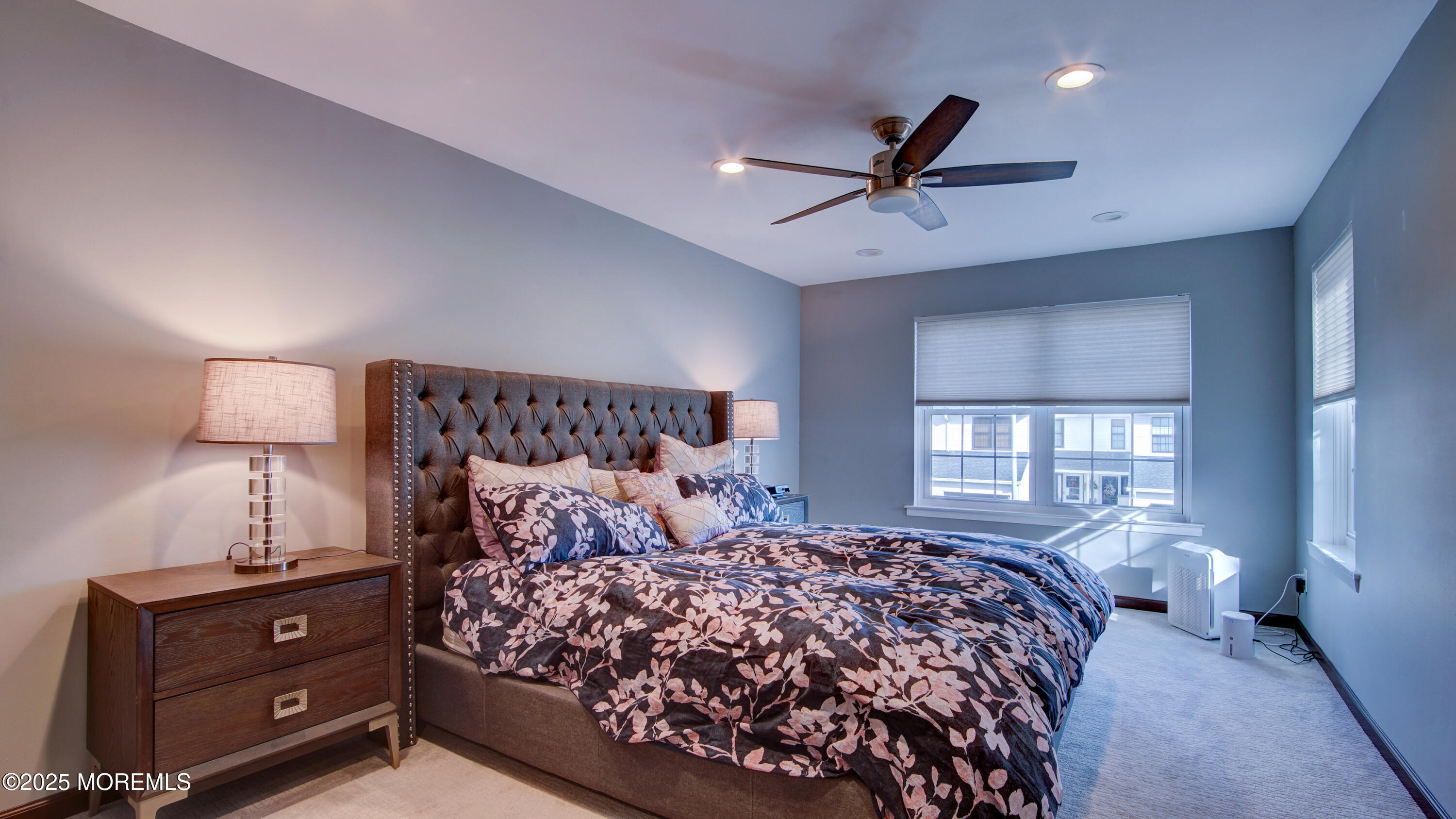 141 Chestnut Way, Unit 141 Manalapan, NJ 07726 - Photo 23 of 46 a bedroom with a large bed and a window