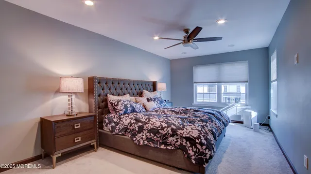 a bedroom with a large bed and a window