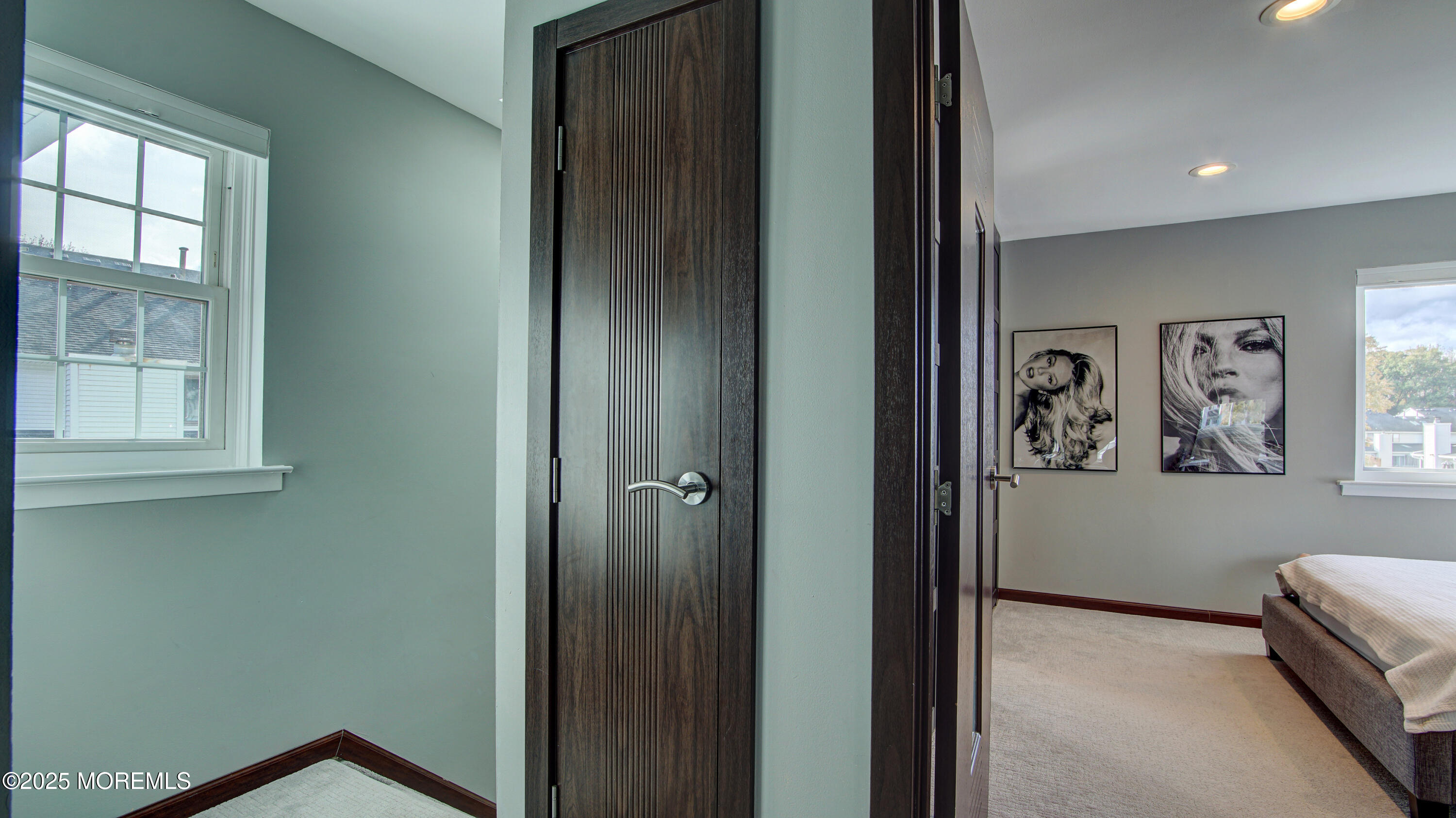 141 Chestnut Way, Unit 141 Manalapan, NJ 07726 - Photo 27 of 46 a view of a hallway with windows and closet