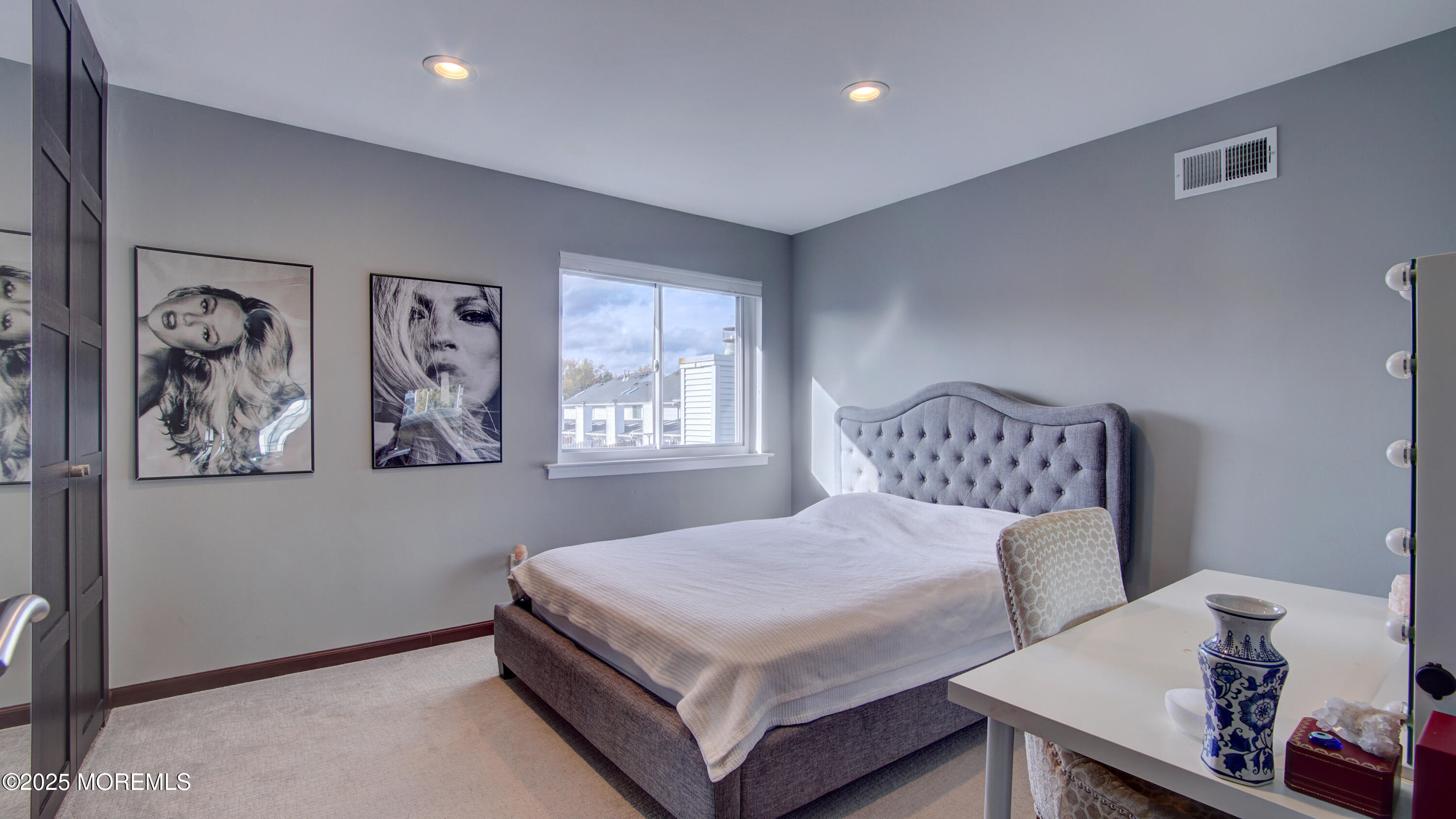 141 Chestnut Way, Unit 141 Manalapan, NJ 07726 - Photo 28 of 46 a bedroom with a bed and wall painting