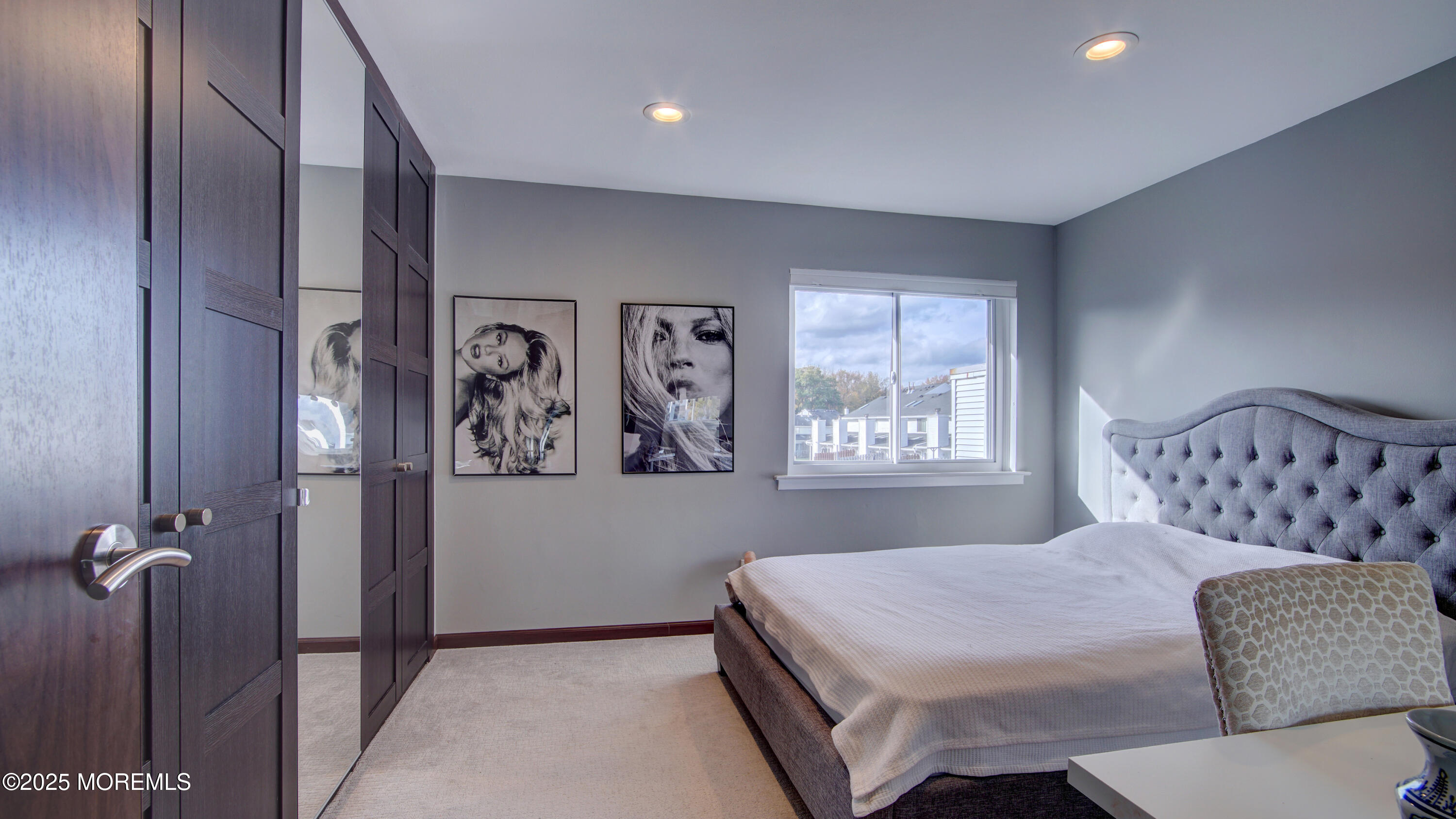 141 Chestnut Way, Unit 141 Manalapan, NJ 07726 - Photo 29 of 46 a bedroom with a bed and a painting on the wall