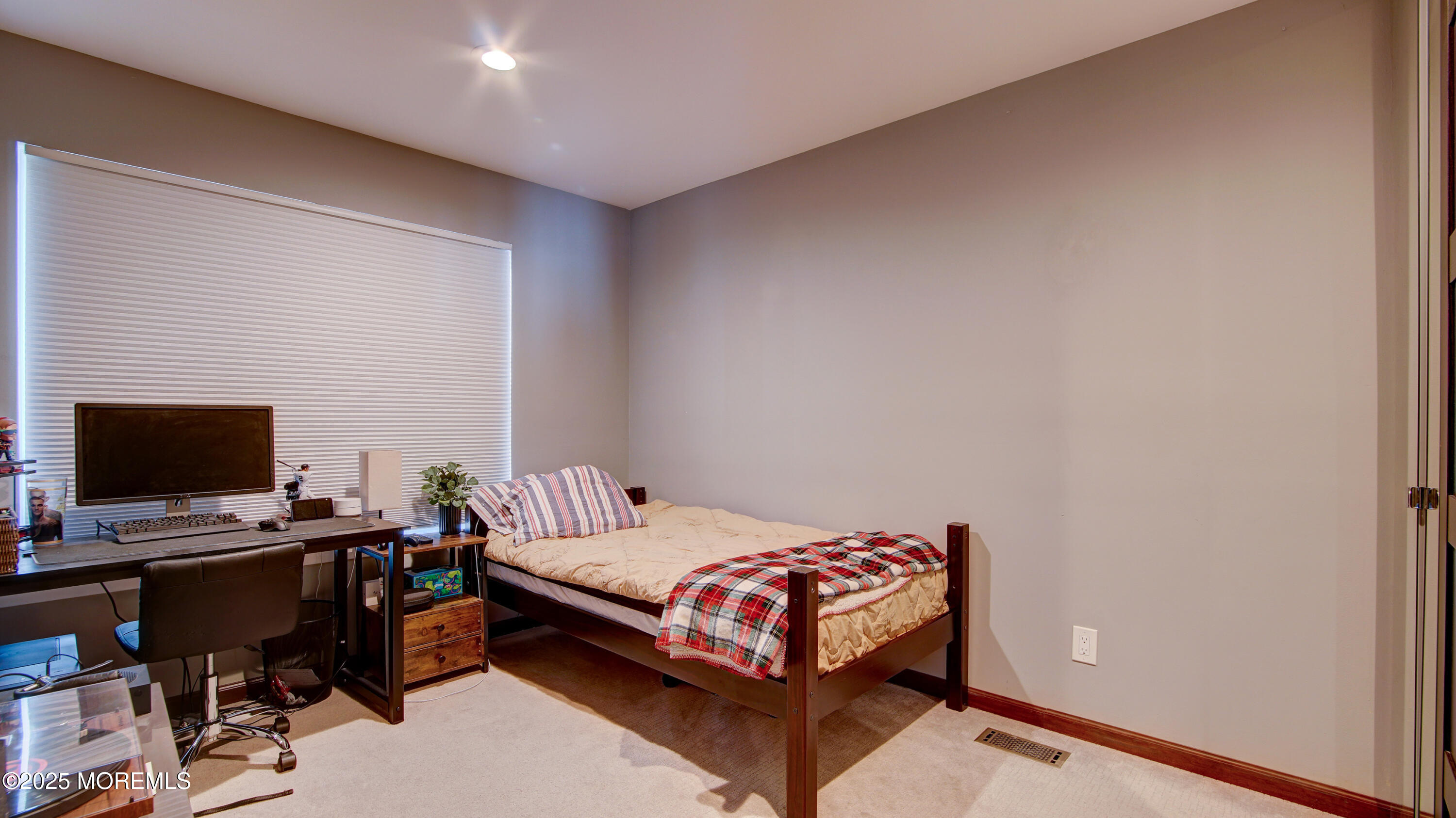 141 Chestnut Way, Unit 141 Manalapan, NJ 07726 - Photo 32 of 46 a bedroom with a bed and a computer on a desk