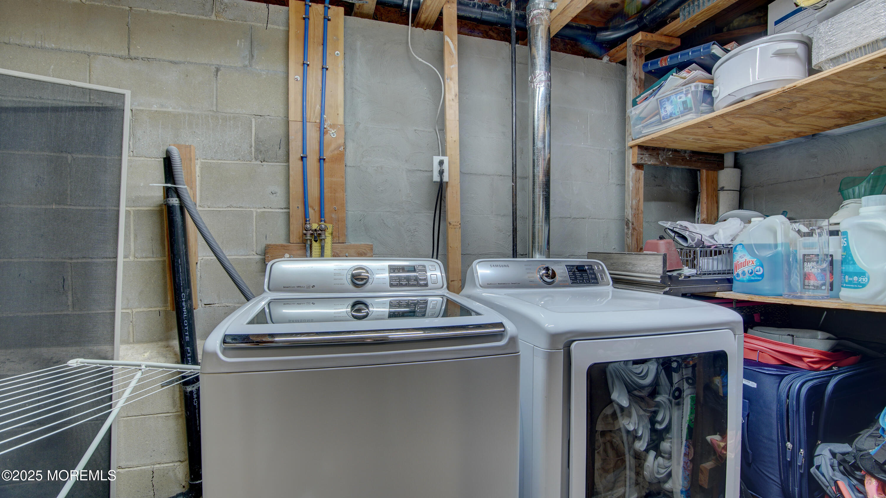 141 Chestnut Way, Unit 141 Manalapan, NJ 07726 - Photo 38 of 46 a utility room with dryer and washer