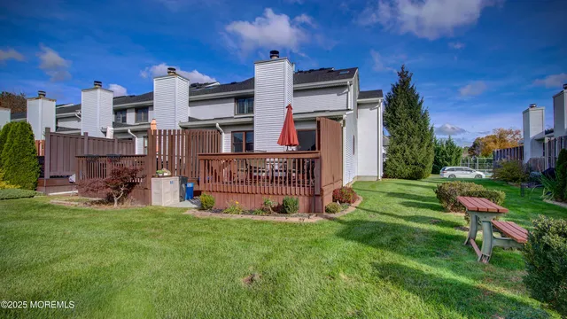 a view of a house with a yard porch and sitting area