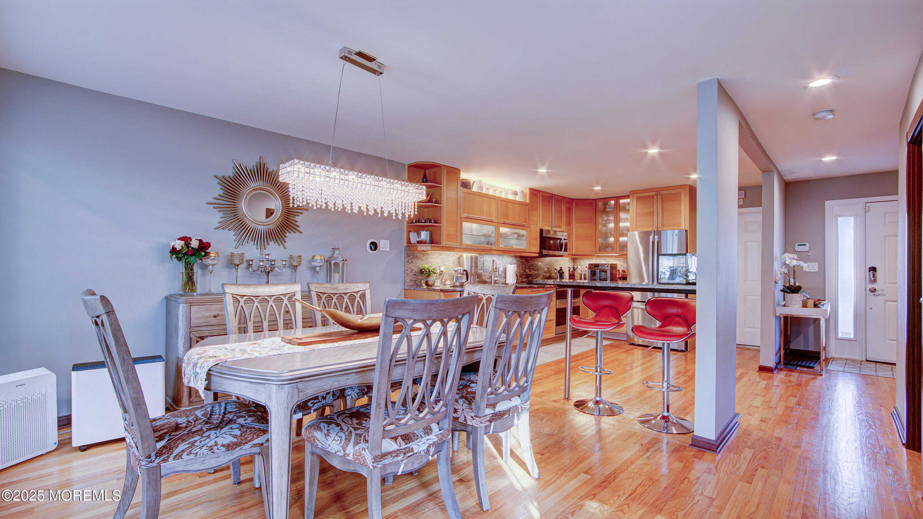 141 Chestnut Way, Unit 141 Manalapan, NJ 07726 - Photo 10 of 46 a view of a dining room with furniture and wooden floor