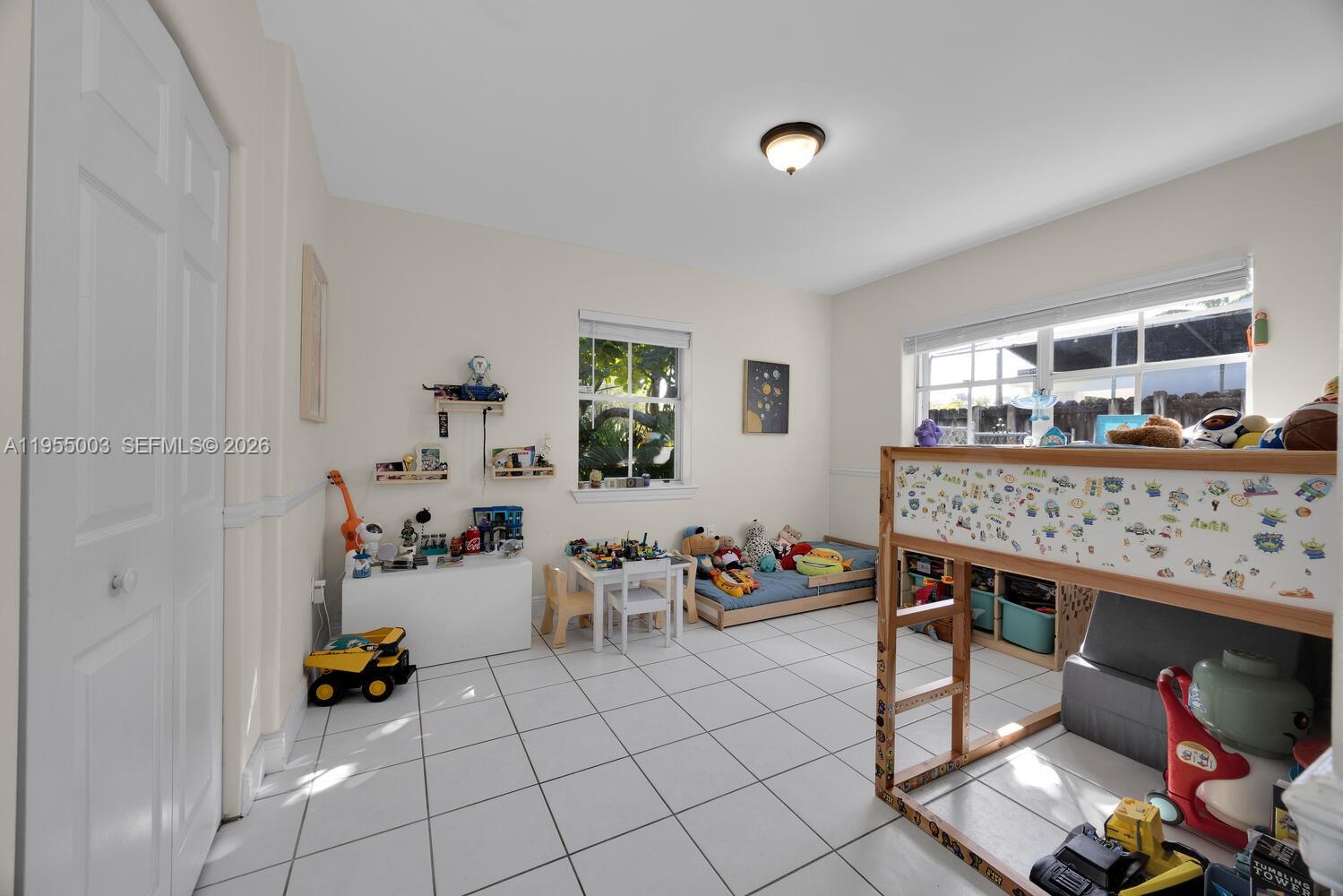 8230 Southwest 63rd Place Miami, FL 33143 - Photo 12 of 24 a reading room with furniture and a window