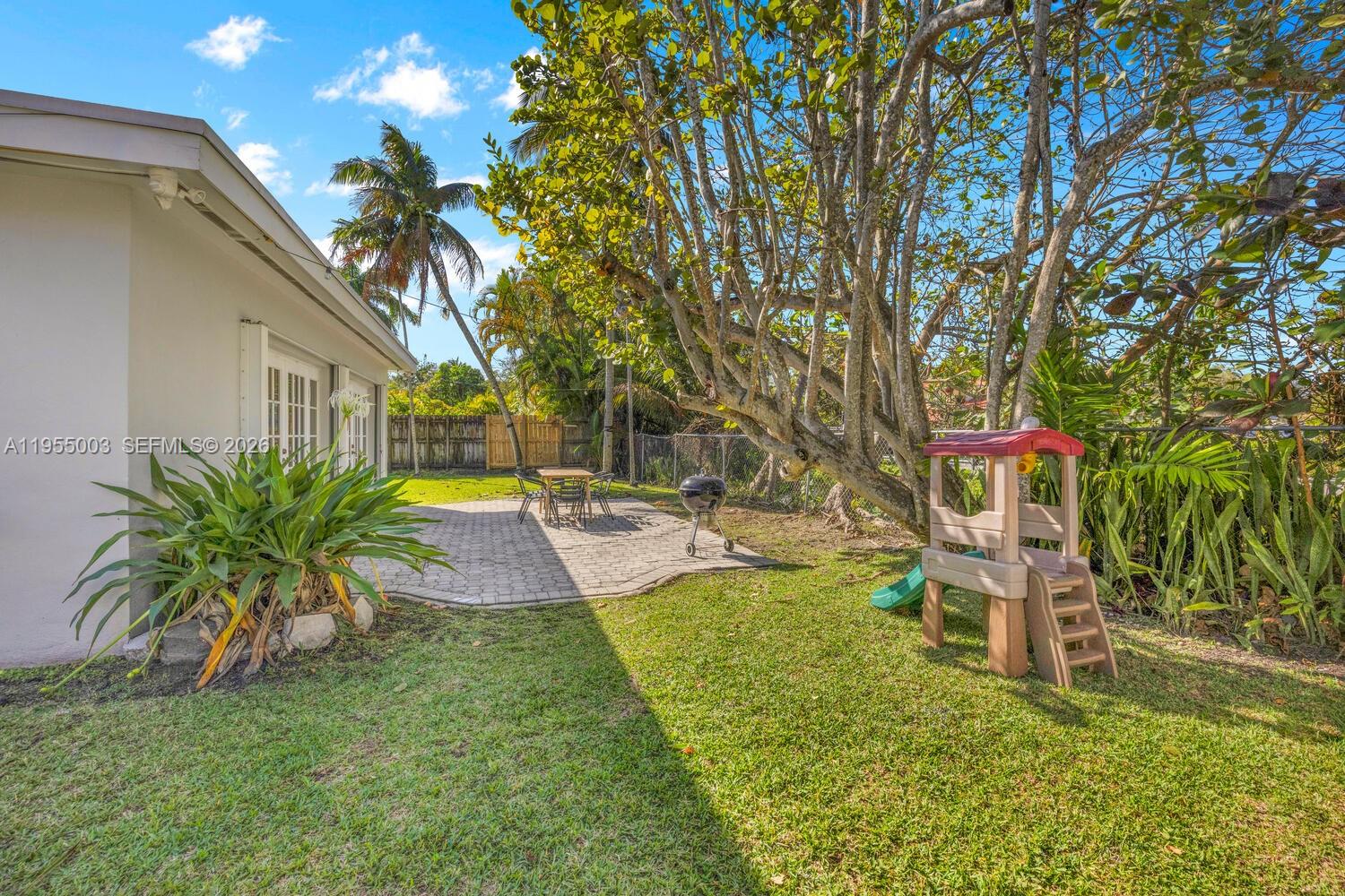 8230 Southwest 63rd Place Miami, FL 33143 - Photo 15 of 24 a front view of a house with garden