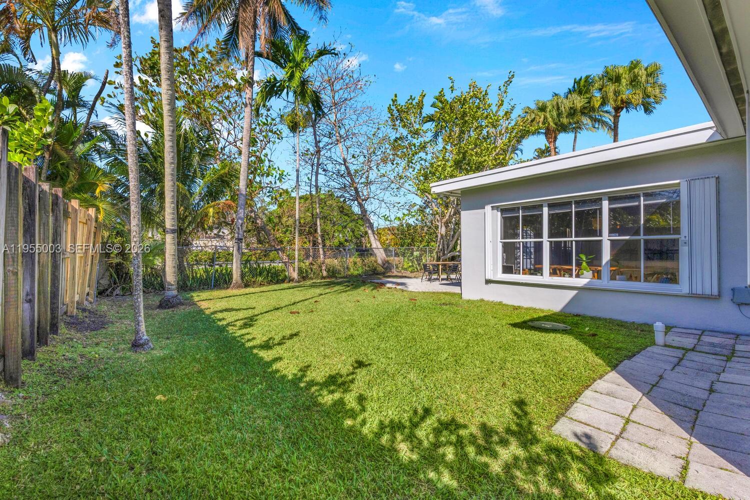 8230 Southwest 63rd Place Miami, FL 33143 - Photo 20 of 24 a view of a house with backyard and sitting area