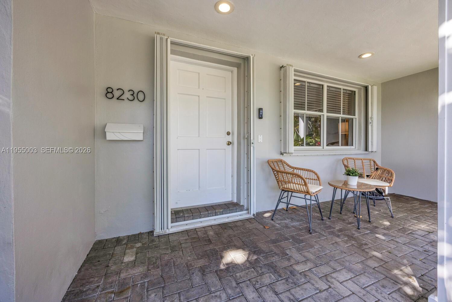 8230 Southwest 63rd Place Miami, FL 33143 - Photo 3 of 24 a view of a livingroom with furniture and windows
