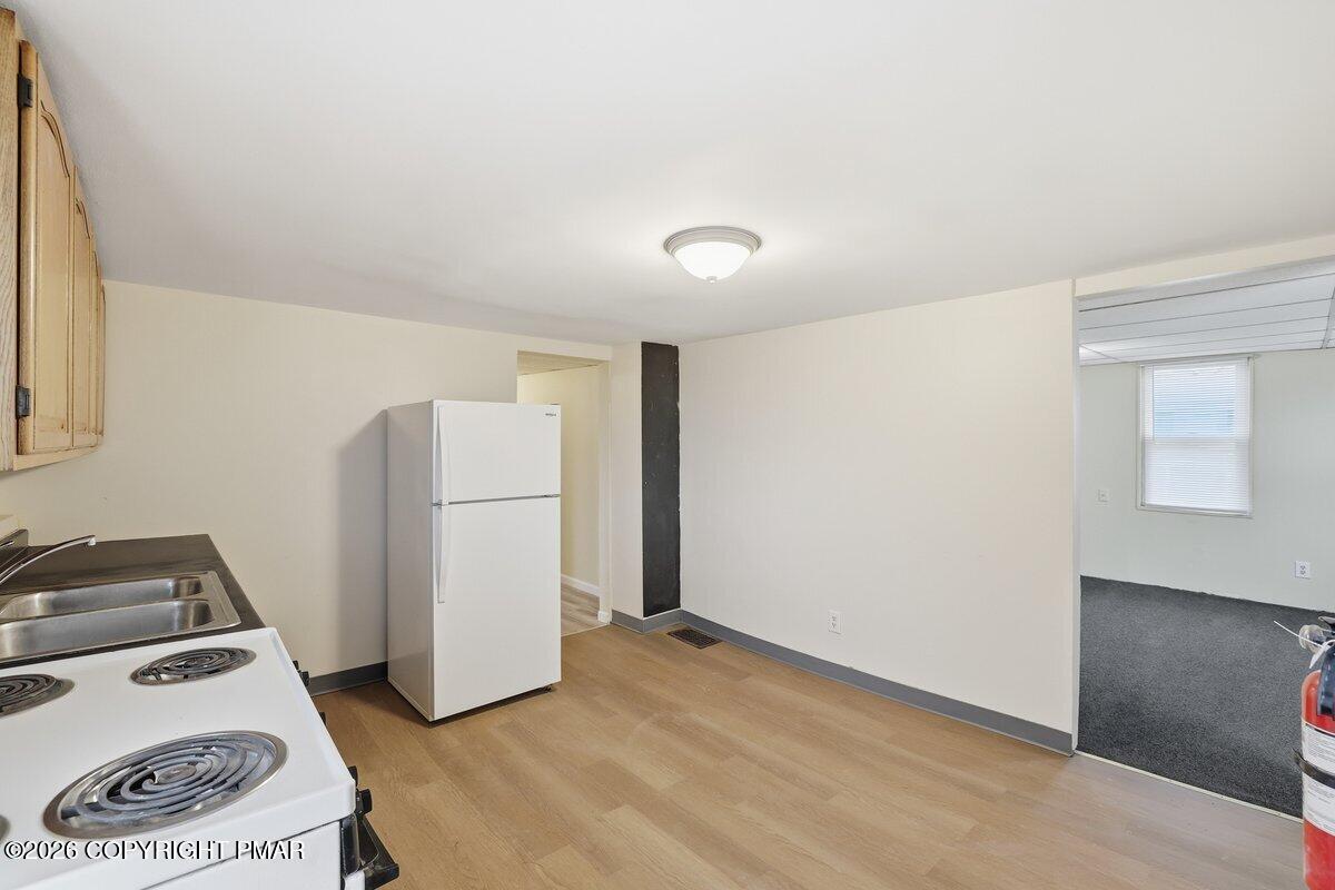 515 Breck Street Scranton, PA 18505 - Photo 30 of 38 a view of a storage & utility room with a fridge