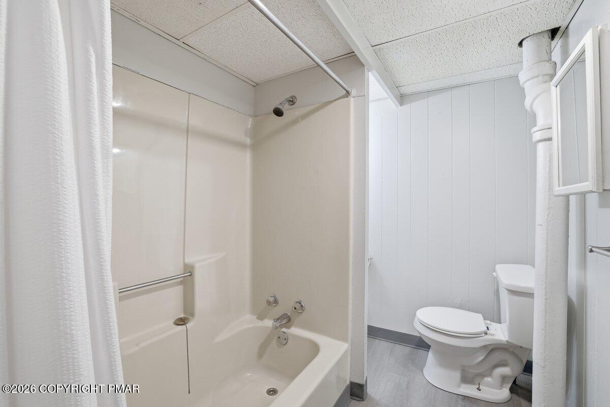 515 Breck Street Scranton, PA 18505 - Photo 34 of 38 a white toilet sitting next to a bath tub
