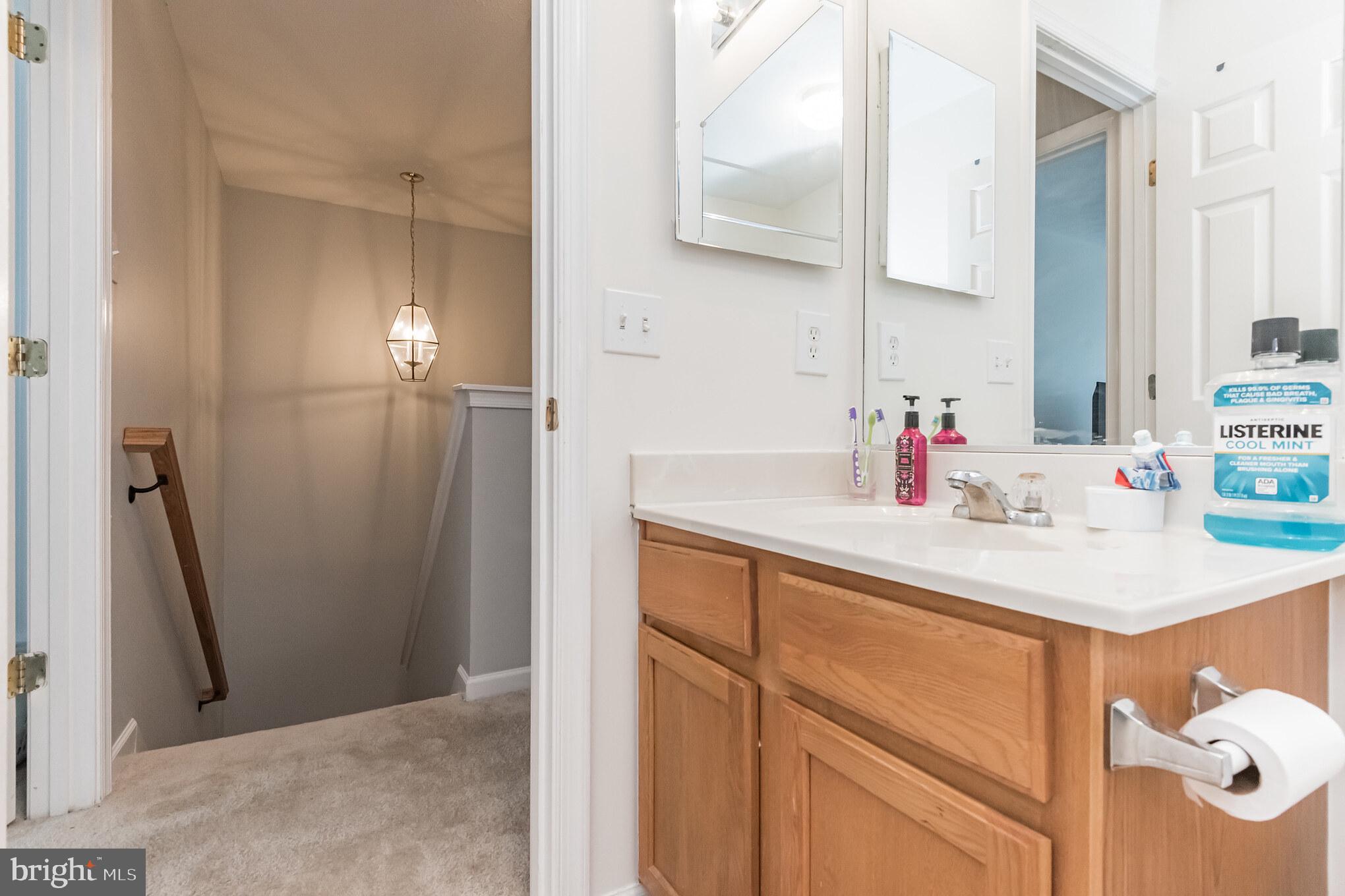 836 Lowe Road Middle River, MD 21220 - Photo 21 of 30 a bathroom with a sink and a mirror