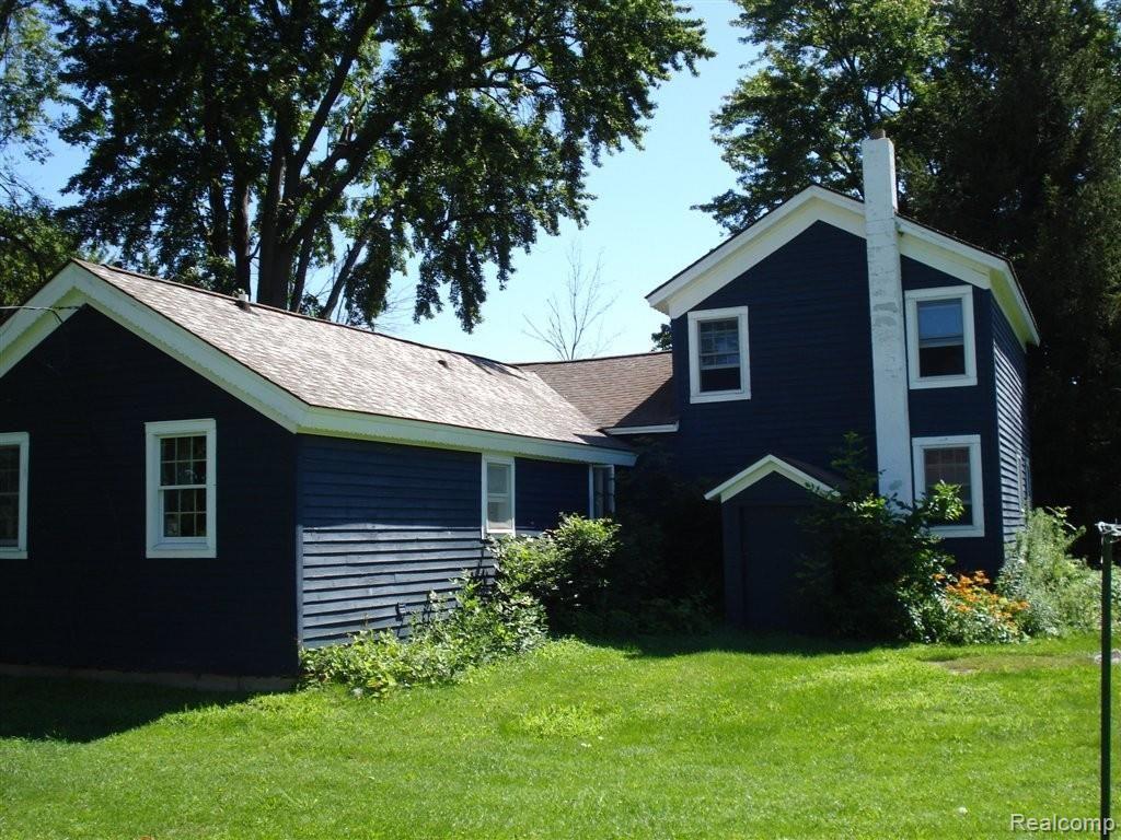 1123 Capac Road Allenton, MI 48002 - Photo 11 of 15 Back of Home.JPG
