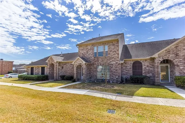 a view of a house with swimming pool and a yard