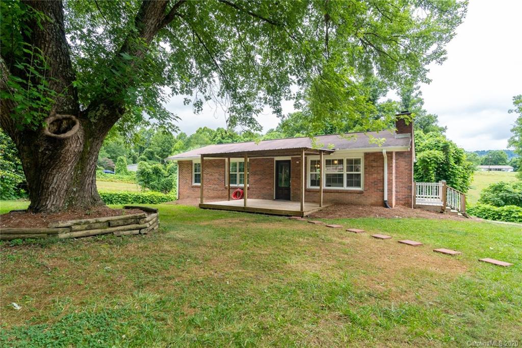 537 Souther Road Fletcher, NC 28732 - Photo 1 of 31 a front view of a house with a garden