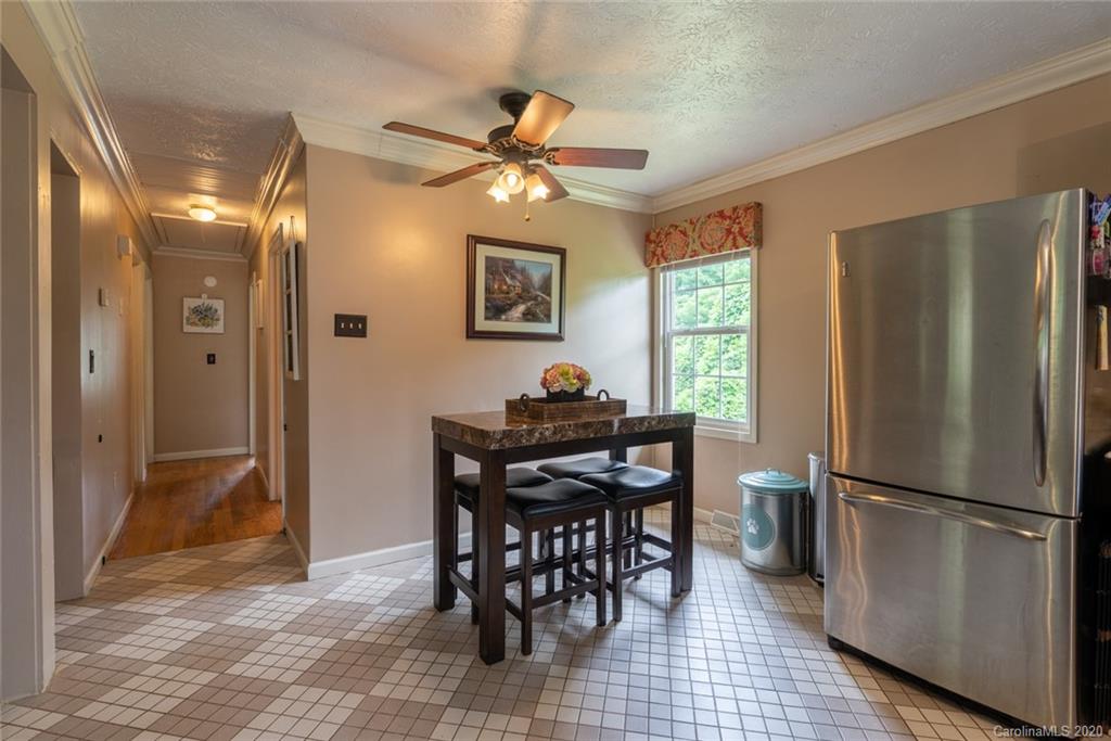 537 Souther Road Fletcher, NC 28732 - Photo 14 of 31 a view of a dining room with furniture window and wooden floor