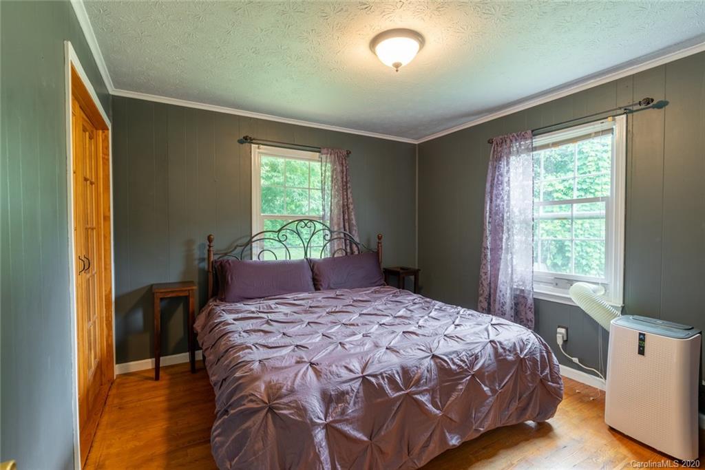 537 Souther Road Fletcher, NC 28732 - Photo 15 of 31 a bedroom with a bed and a window