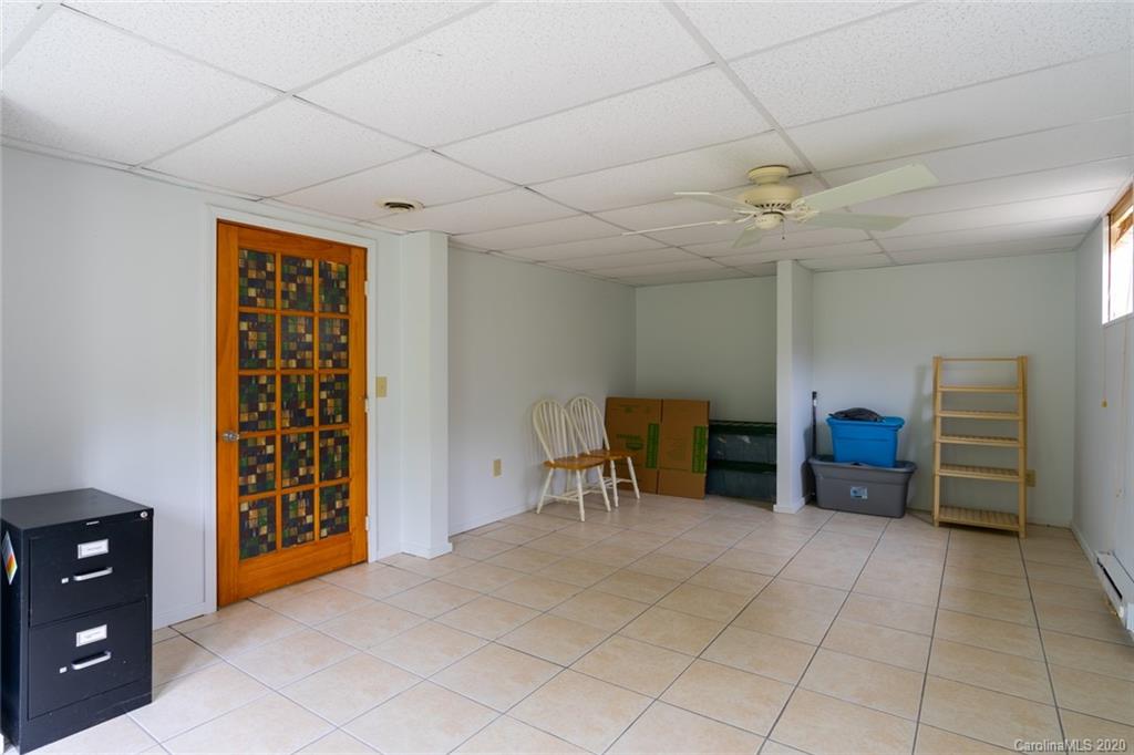 537 Souther Road Fletcher, NC 28732 - Photo 24 of 31 a view of a livingroom with furniture and a ceiling fan