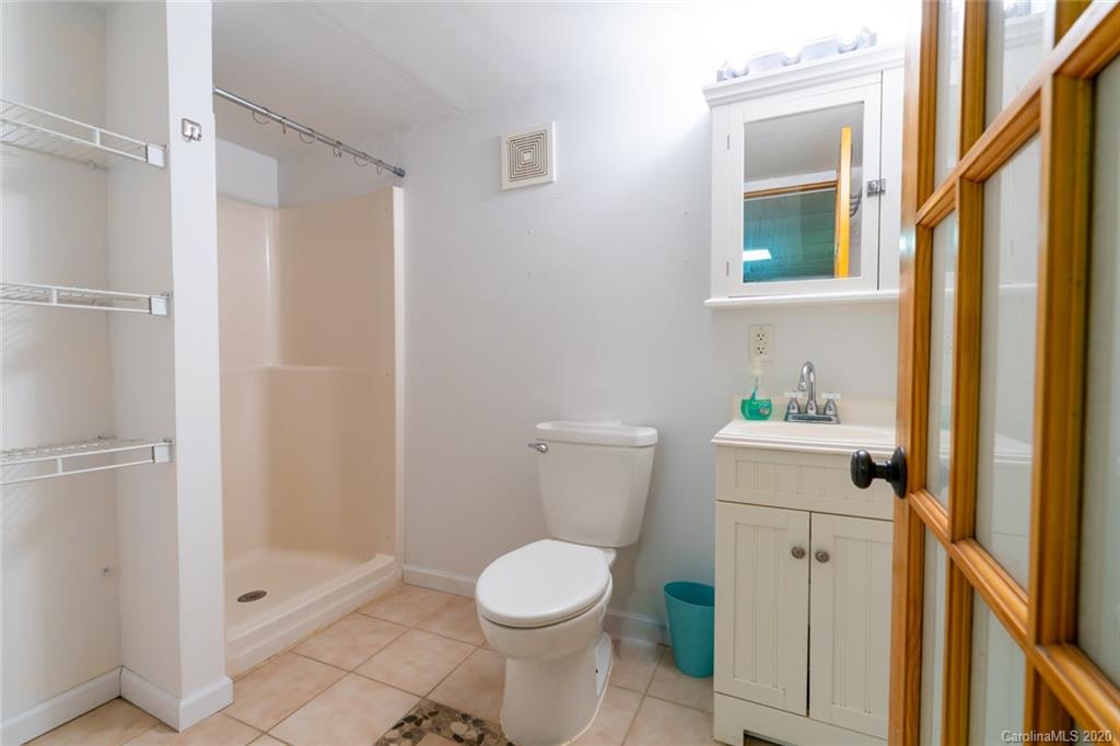 537 Souther Road Fletcher, NC 28732 - Photo 25 of 31 a white toilet sitting next to a bathroom sink