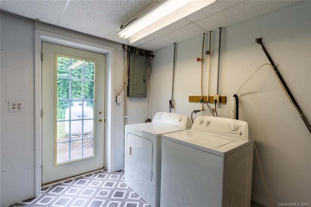 537 Souther Road Fletcher, NC 28732 - Photo 26 of 31 a utility room with a sink dryer and washer