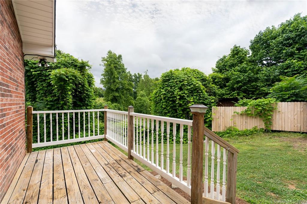 537 Souther Road Fletcher, NC 28732 - Photo 28 of 31 a balcony with trees in front of it