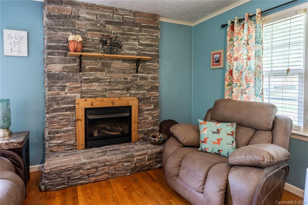 537 Souther Road Fletcher, NC 28732 - Photo 7 of 31 a living room with furniture and a fireplace