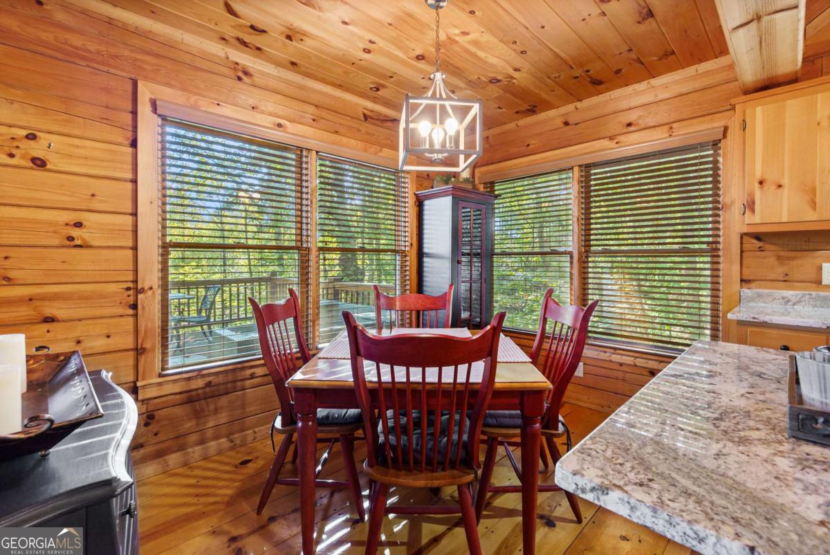 24 Casey Court Blue Ridge, GA 30513 - Photo 11 of 54 a view of a dining room with furniture and wooden floor