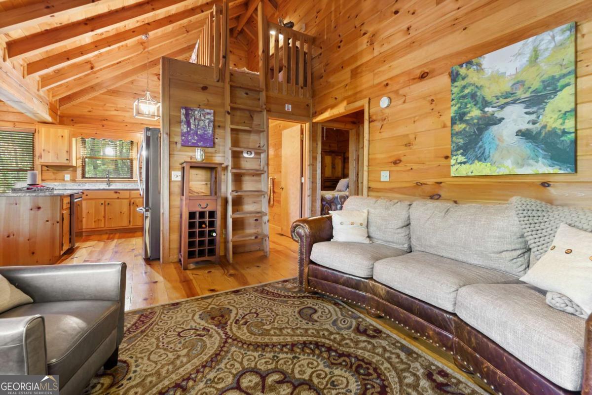 24 Casey Court Blue Ridge, GA 30513 - Photo 16 of 54 a living room with furniture and a rug