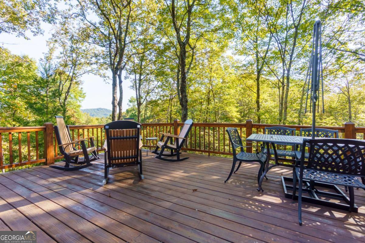 24 Casey Court Blue Ridge, GA 30513 - Photo 22 of 54 a view of a chairs and table on the wooden floor