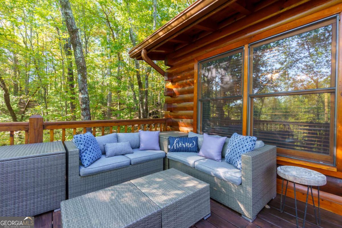 24 Casey Court Blue Ridge, GA 30513 - Photo 23 of 54 a roof deck with couch and wooden floor