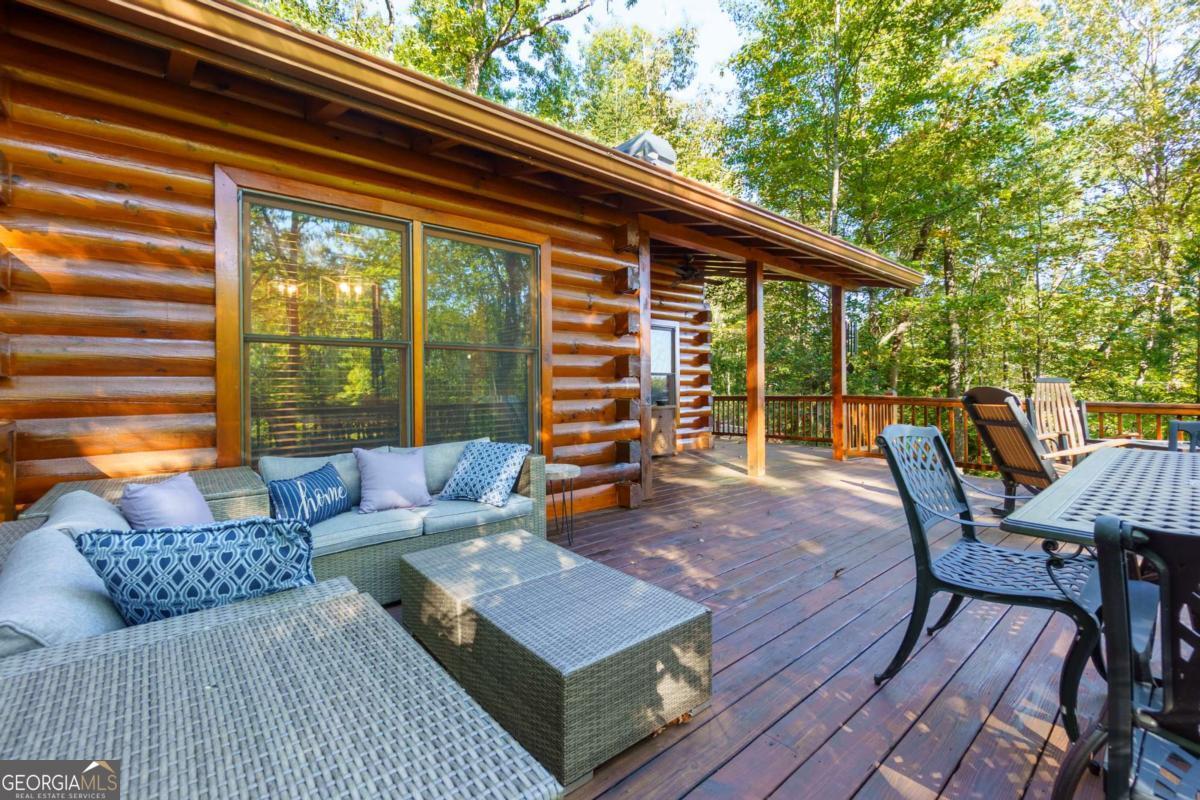 24 Casey Court Blue Ridge, GA 30513 - Photo 24 of 54 a roof deck with table and chairs and wooden floor