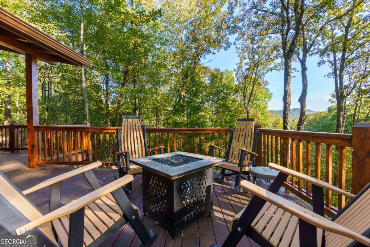 24 Casey Court Blue Ridge, GA 30513 - Photo 27 of 54 a view of a wooden chairs on deck