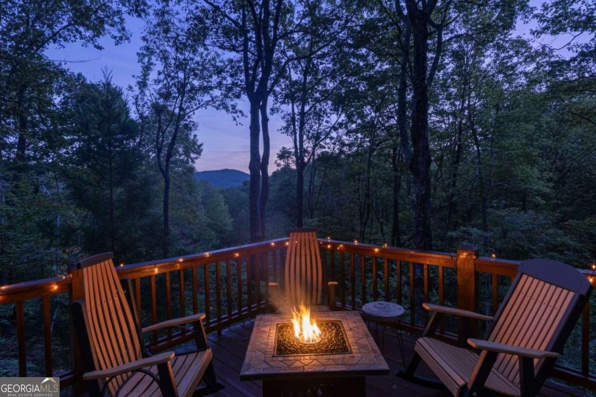 24 Casey Court Blue Ridge, GA 30513 - Photo 28 of 54 a view of a wooden deck with a bench