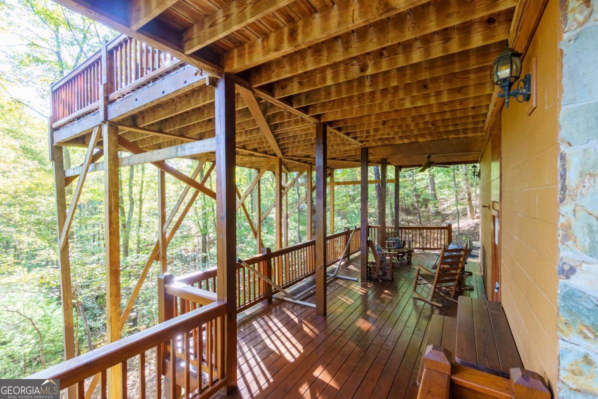 24 Casey Court Blue Ridge, GA 30513 - Photo 38 of 54 a view of balcony with chairs and wooden floor