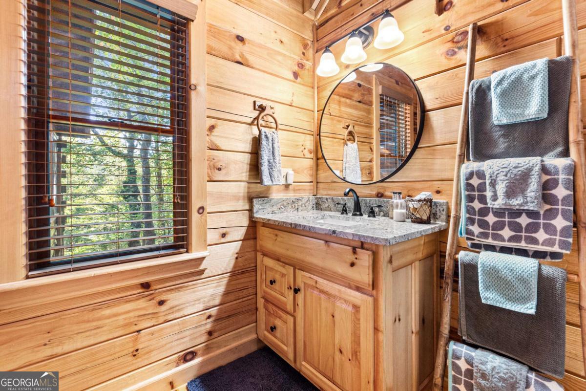 24 Casey Court Blue Ridge, GA 30513 - Photo 4 of 54 a bathroom with a sink and a mirror