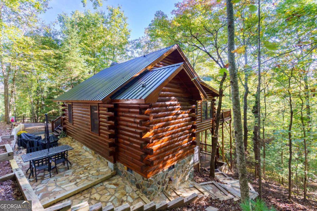 24 Casey Court Blue Ridge, GA 30513 - Photo 43 of 54 a front view of house with a garden