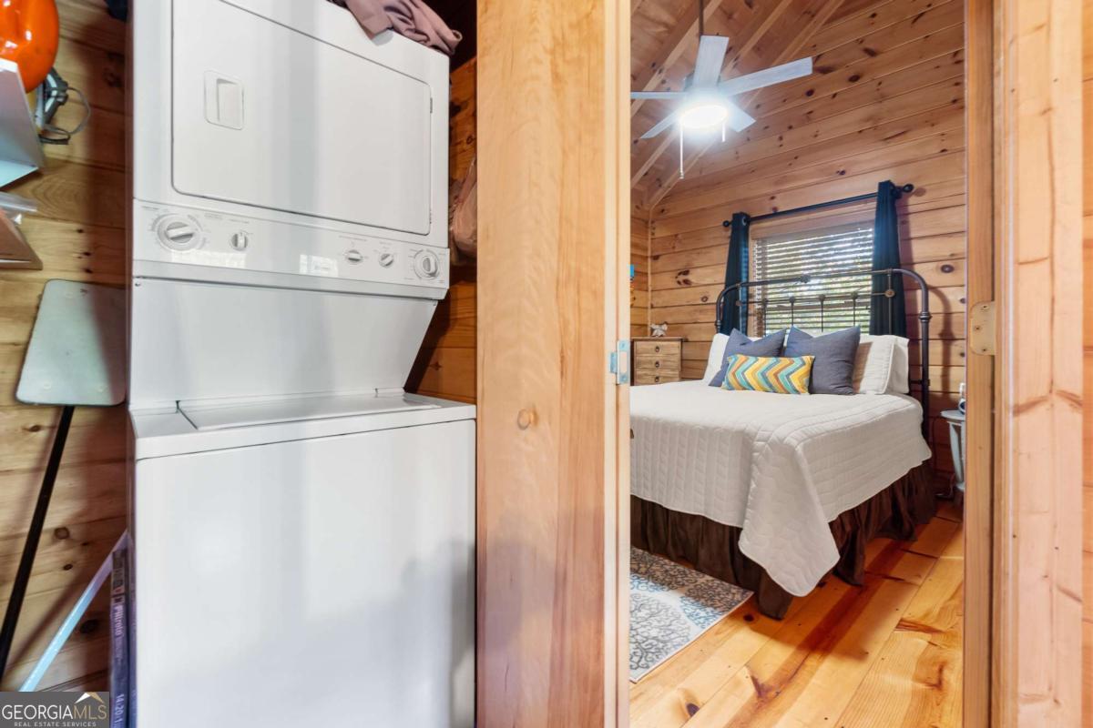 24 Casey Court Blue Ridge, GA 30513 - Photo 8 of 54 a bed room with a bed and a refrigerator