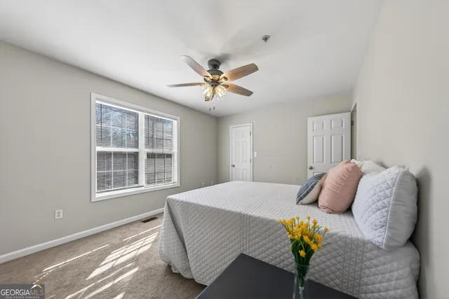 a bedroom with a bed and window