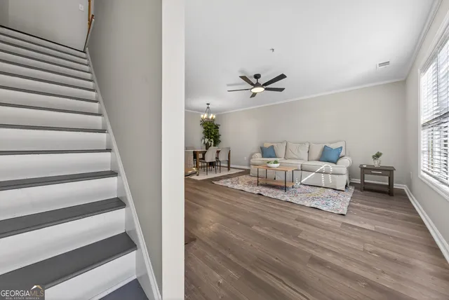 a living room with furniture and a table