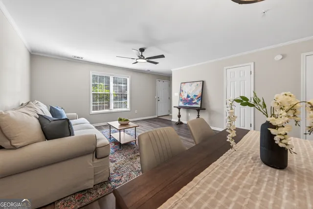 a view of a dining room with furniture window and wooden floor