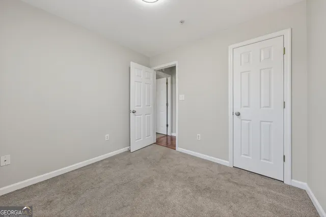 a bathroom with a toilet a sink and a mirror