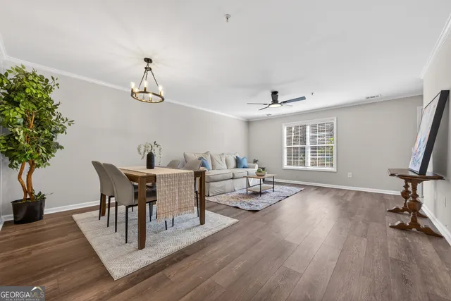 a view of a dining room with furniture window and wooden floor