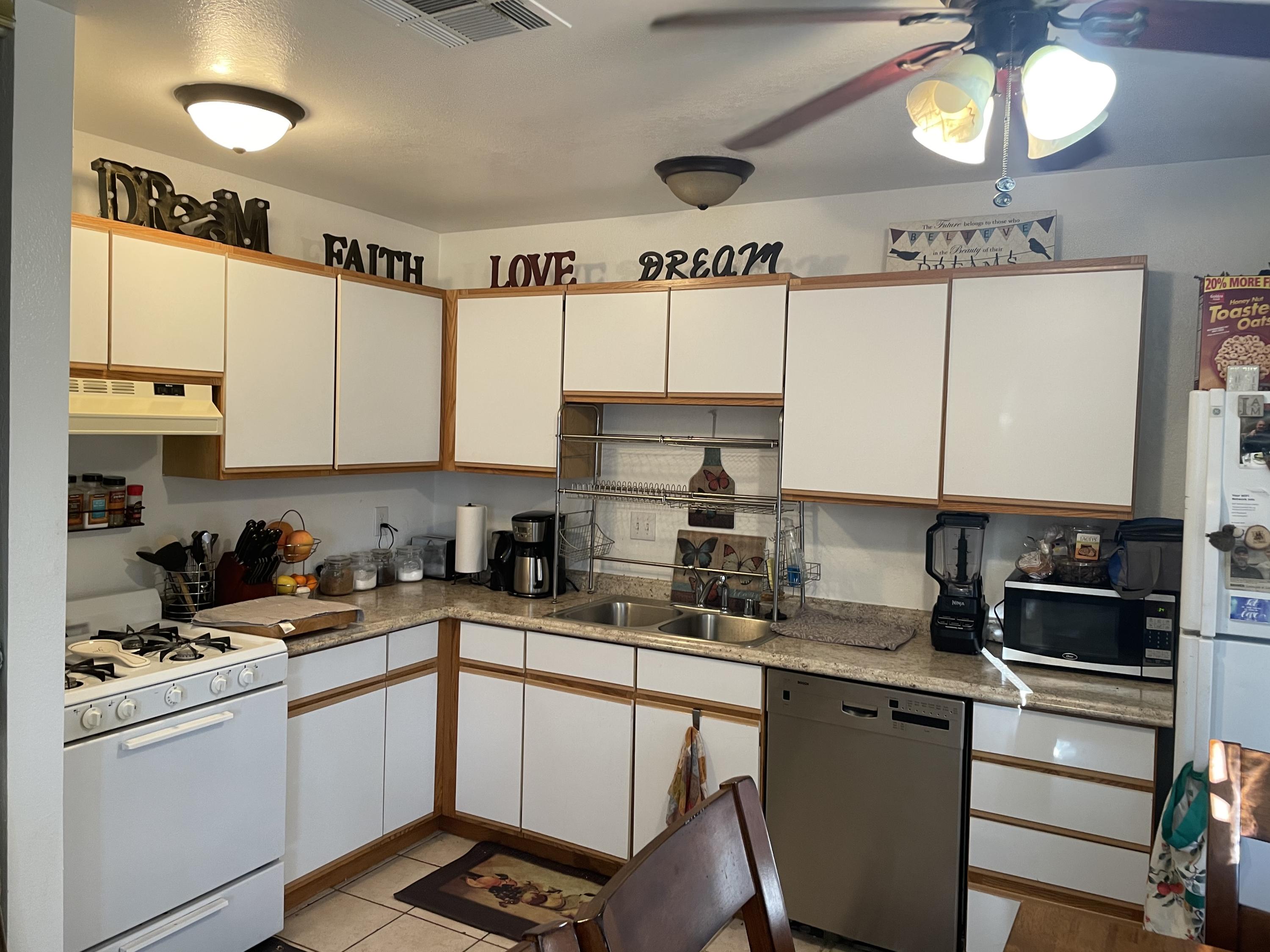 41929 Front Hall Road Bermuda Dunes, CA 92203 - Photo 3 of 12 a kitchen with a sink cabinets and window
