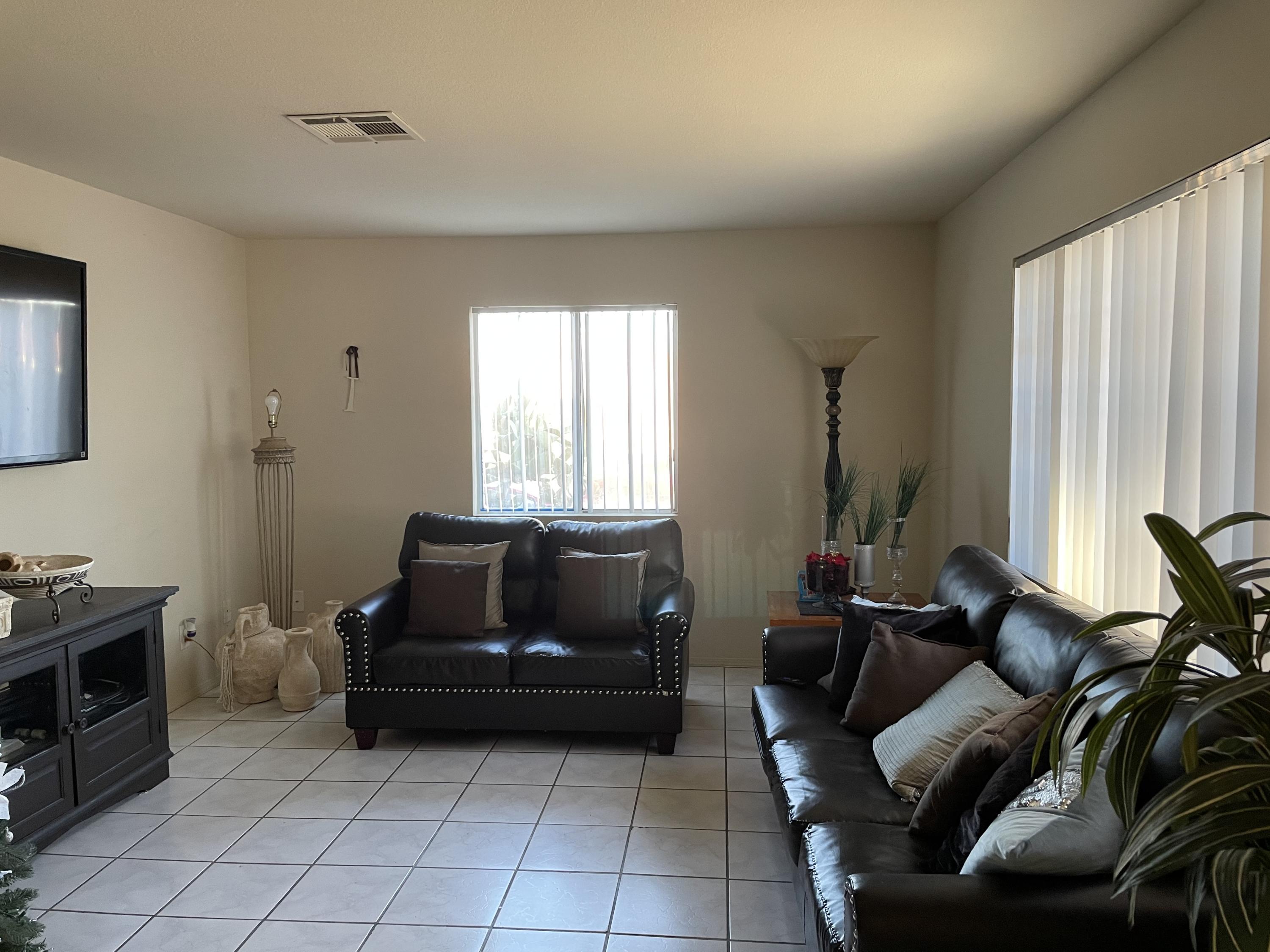 41929 Front Hall Road Bermuda Dunes, CA 92203 - Photo 8 of 12 a living room with furniture and a window