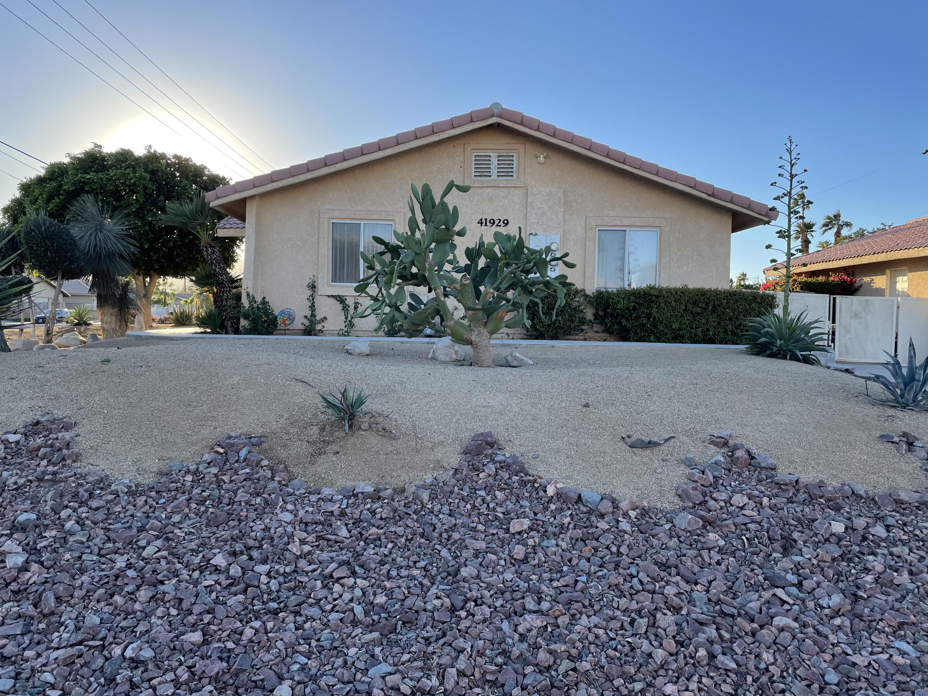 41929 Front Hall Road Bermuda Dunes, CA 92203 - Photo 9 of 12 a front view of a house with a yard