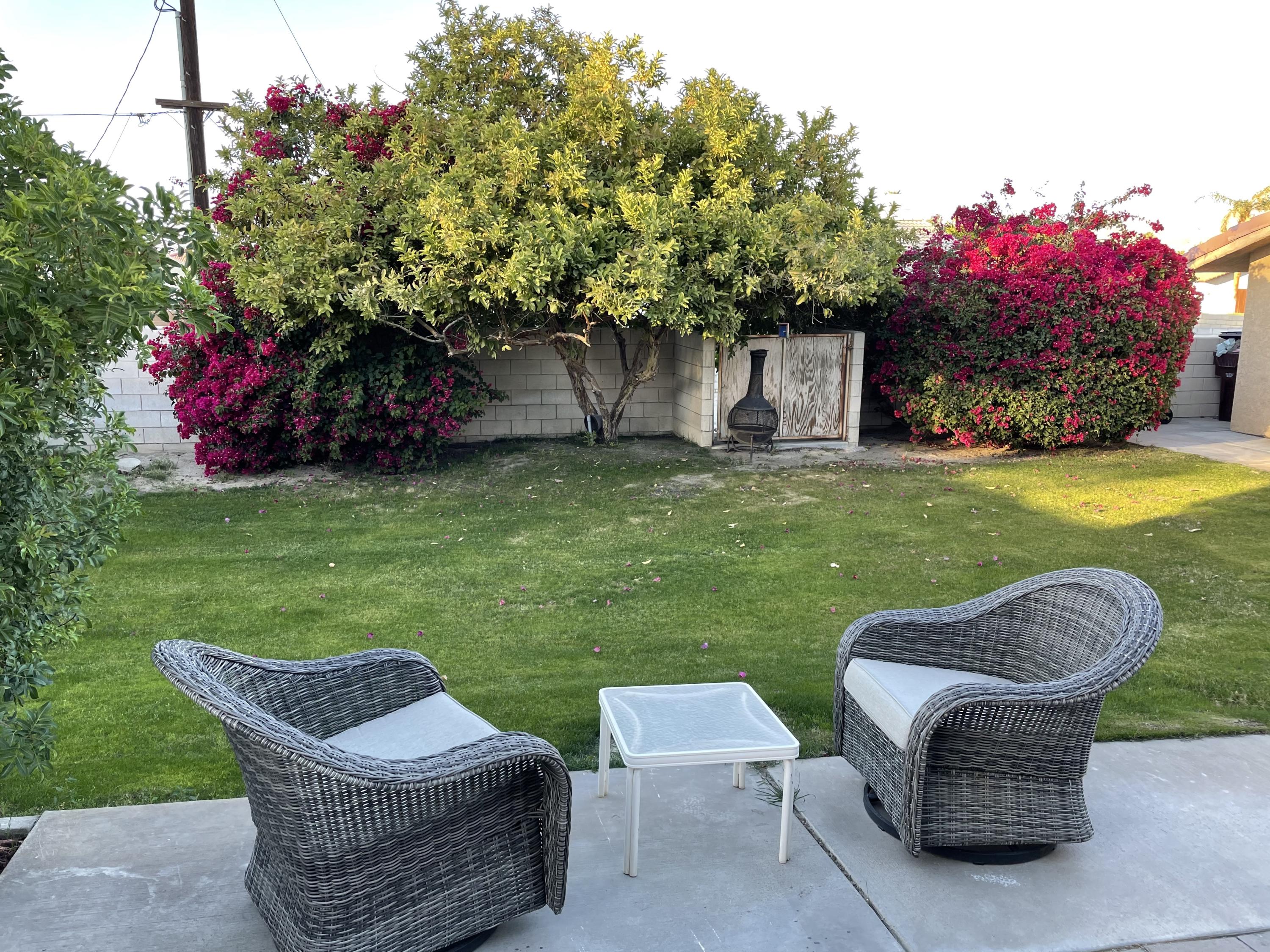 41929 Front Hall Road Bermuda Dunes, CA 92203 - Photo 10 of 12 a backyard of a house with table and chairs