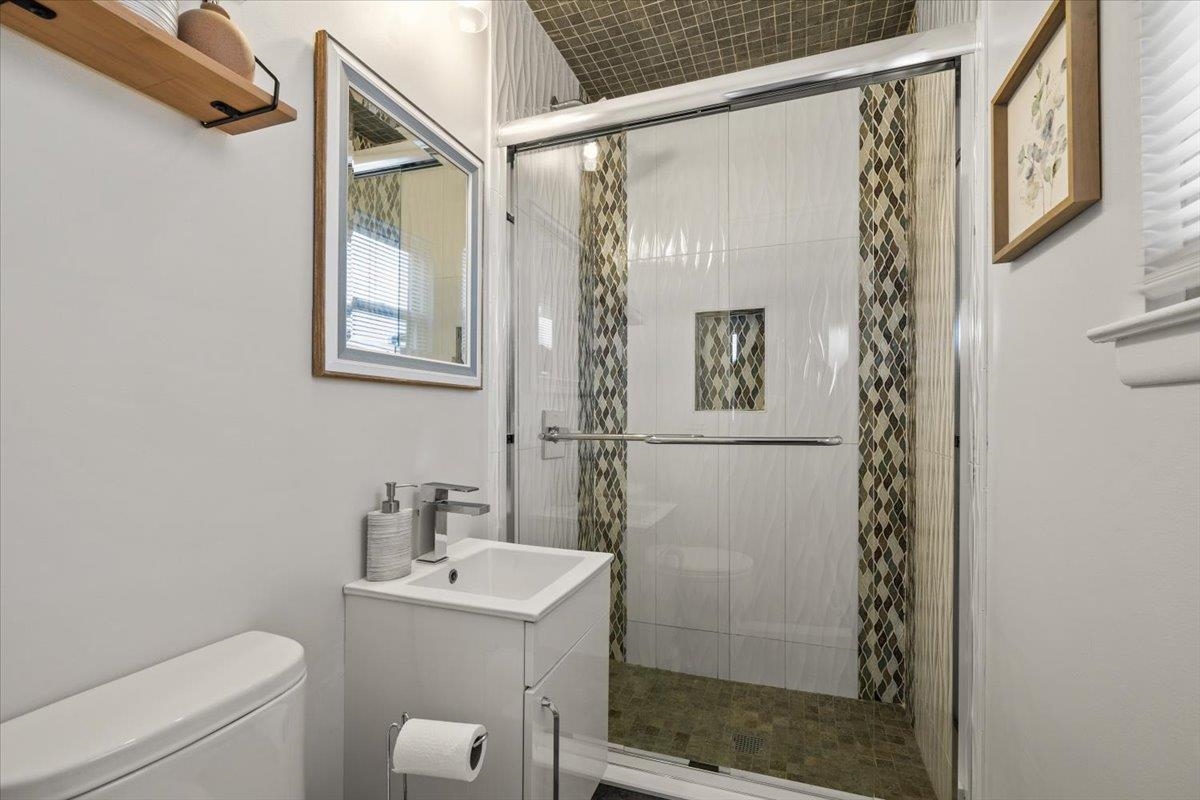 1138F Farm Road, Unit B Secaucus, NJ 07094 - Photo 17 of 20 a bathroom with a shower a sink and a toilet